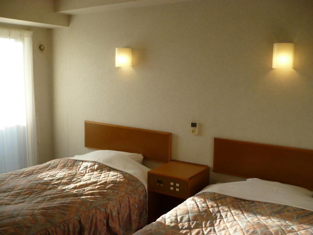 Hotel New Budget Muroran Værelse billede