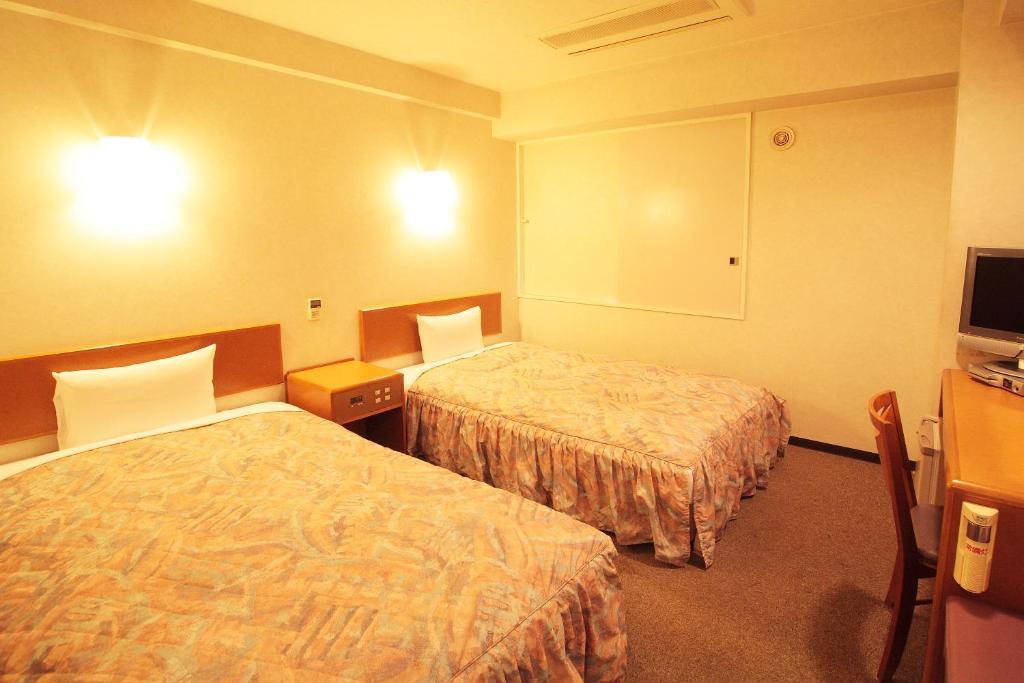 Hotel New Budget Muroran Værelse billede